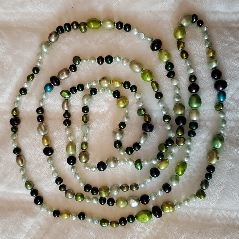 Long 60 inch freshwater pearl necklace with various shades of green,NWOT.